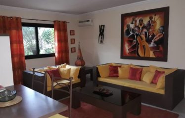 SALY : Ensemble immobilier à vendre comprenant un appartement et une boutique